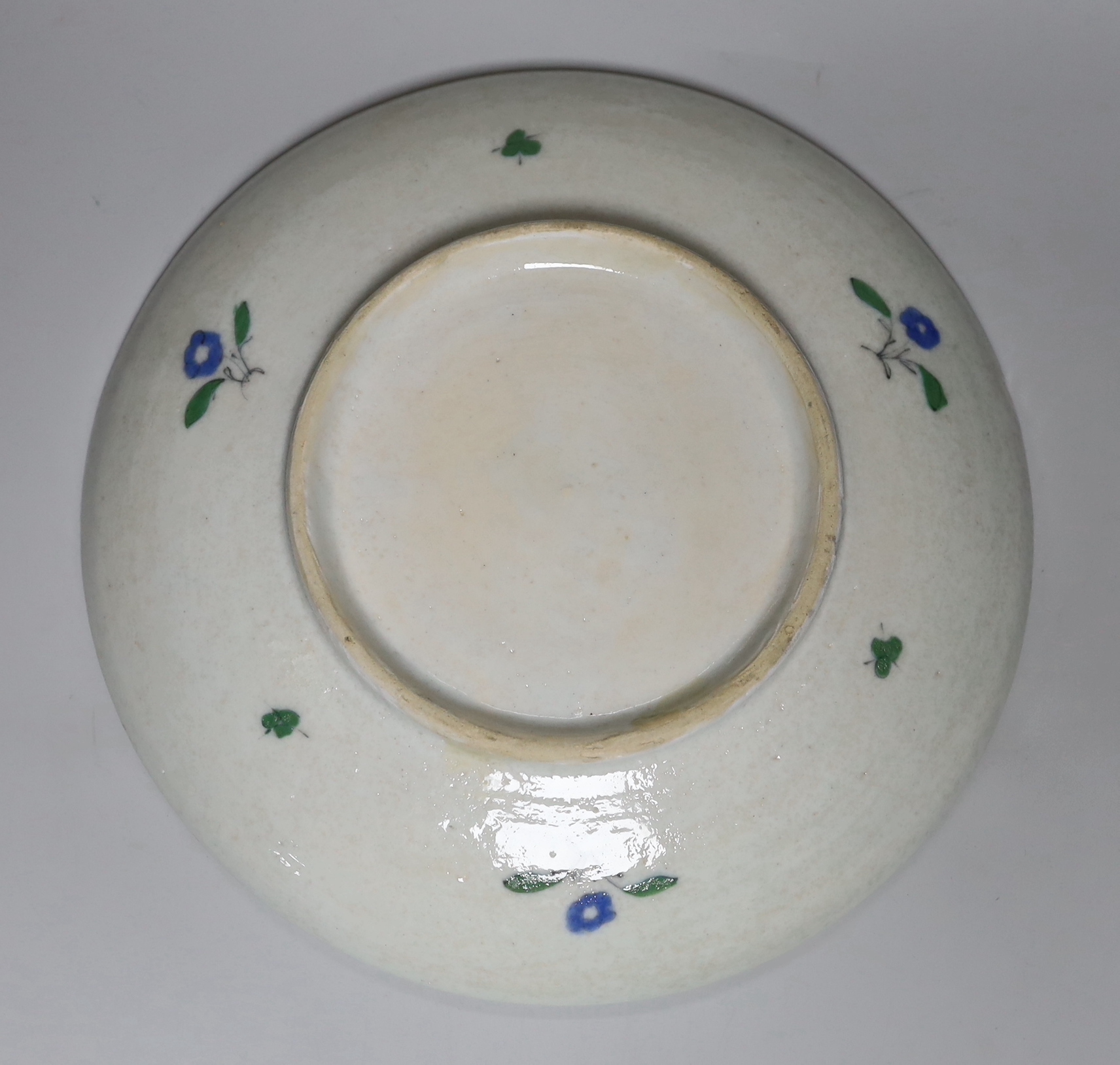 A Turkish Isnik style plate decorated with a bird amongst flowers, 29.5cm in diameter